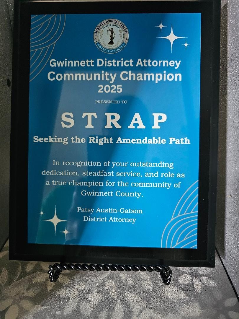 Framed Gwinnett District Attorney Community Champion 2025 award presented to STRAP.
