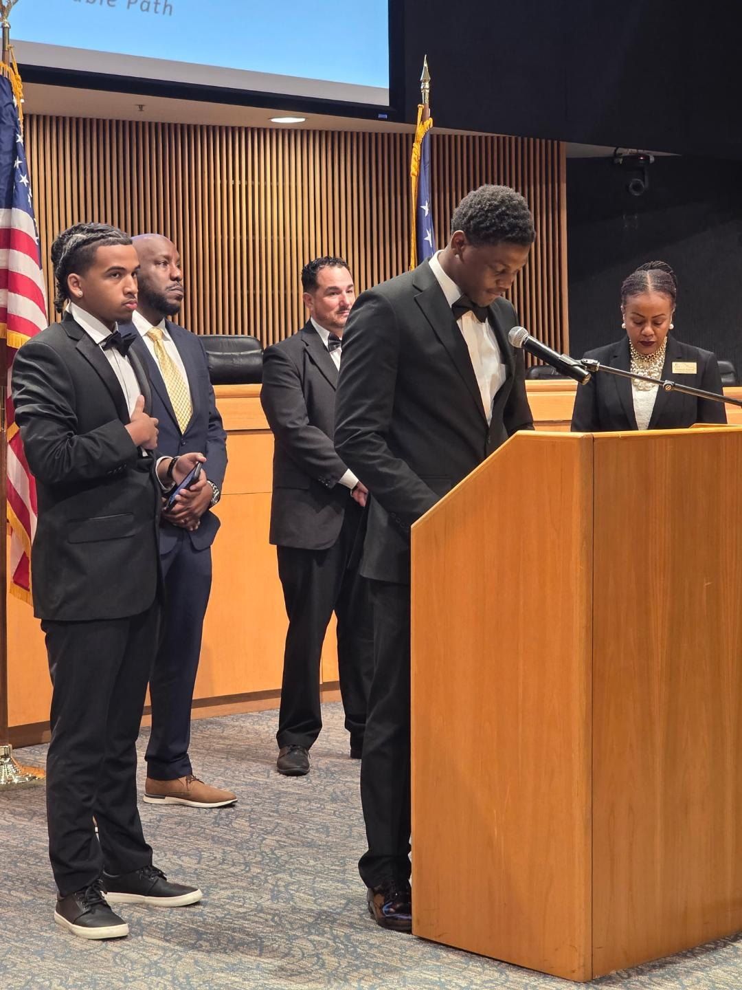 STRAP youth speaking at a program completion event